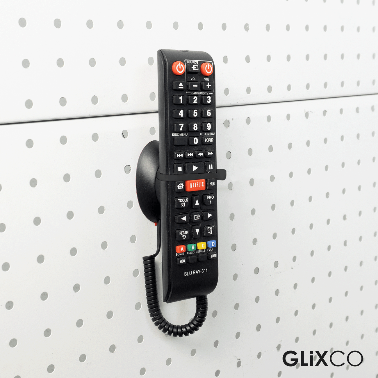 Cable Retráctil Imantado para Control Remoto / Soporte Magnético Antipérdida / Fijación en pared / Largo Max 80cm